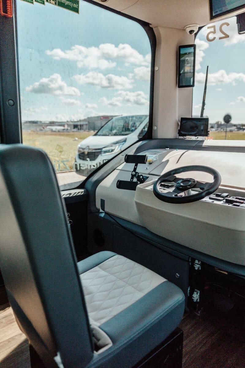 Zurich Airport’s automated shuttles now operate without a safety driver on board 1 Empty safety driver seat and manual controls inside a Zurich Airport automated shuttle